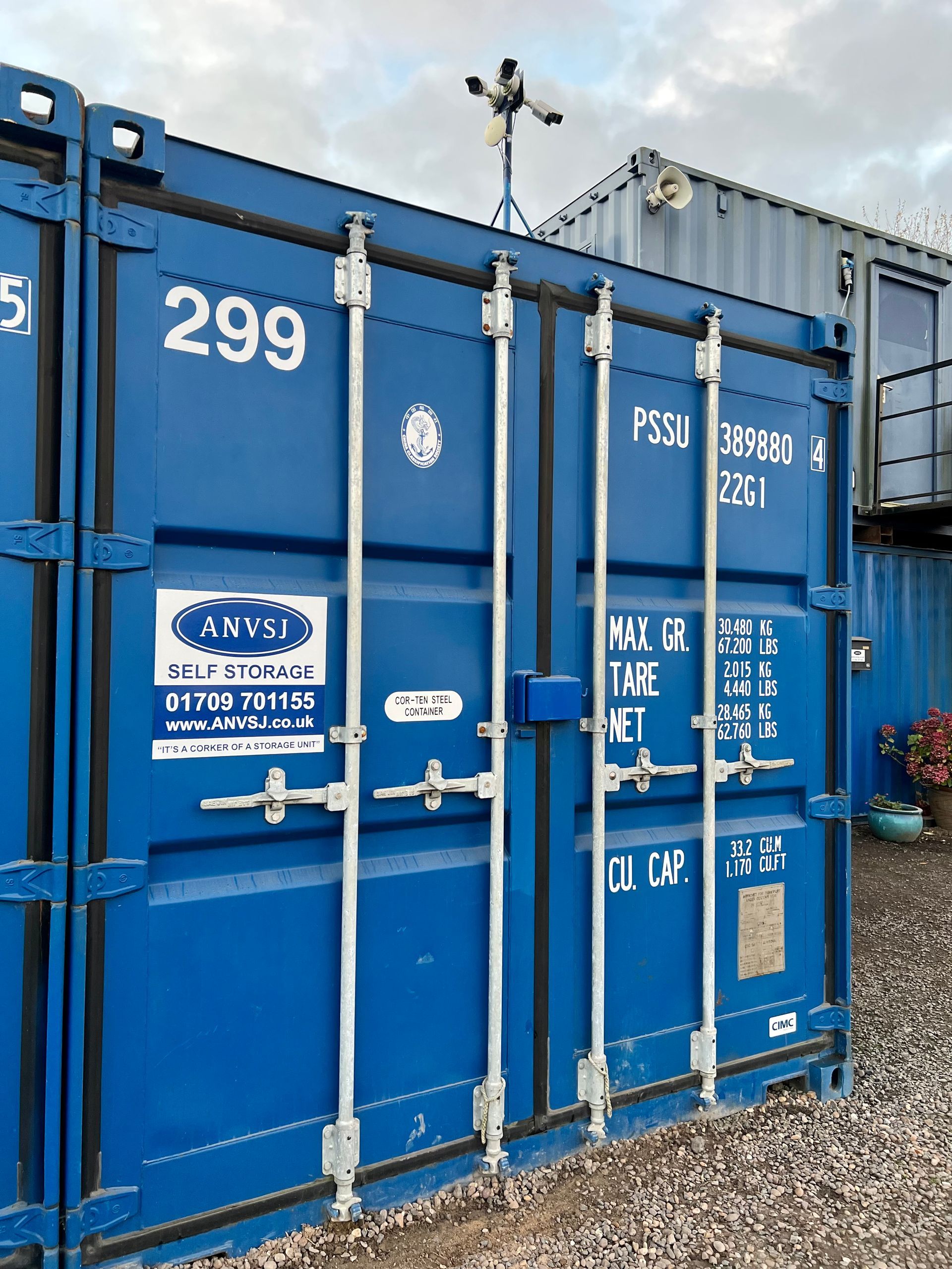 A blue shipping container marked 