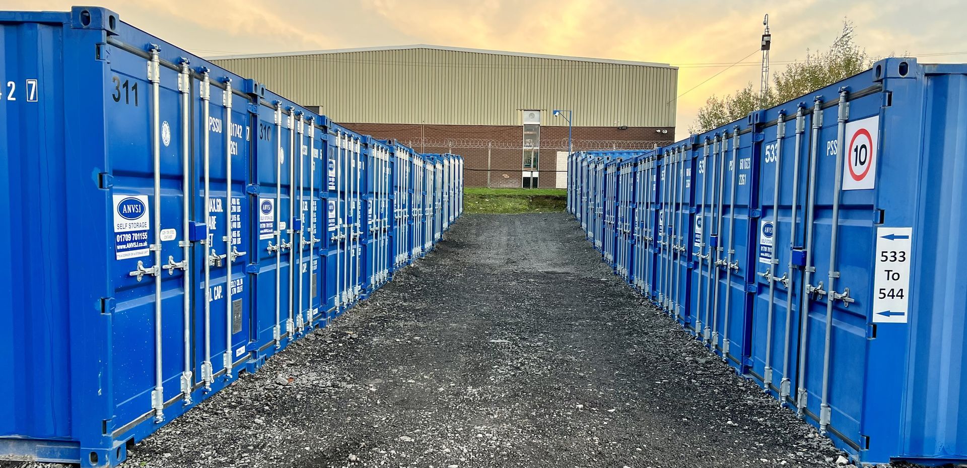 Blue storage containers in Chesterfield with a path 