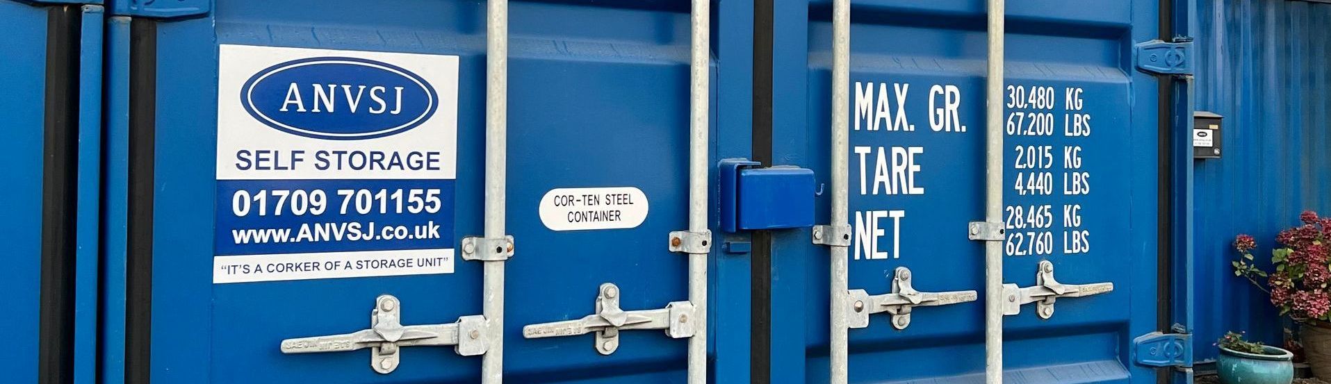 Blue Storage Containers with the company name and number on it