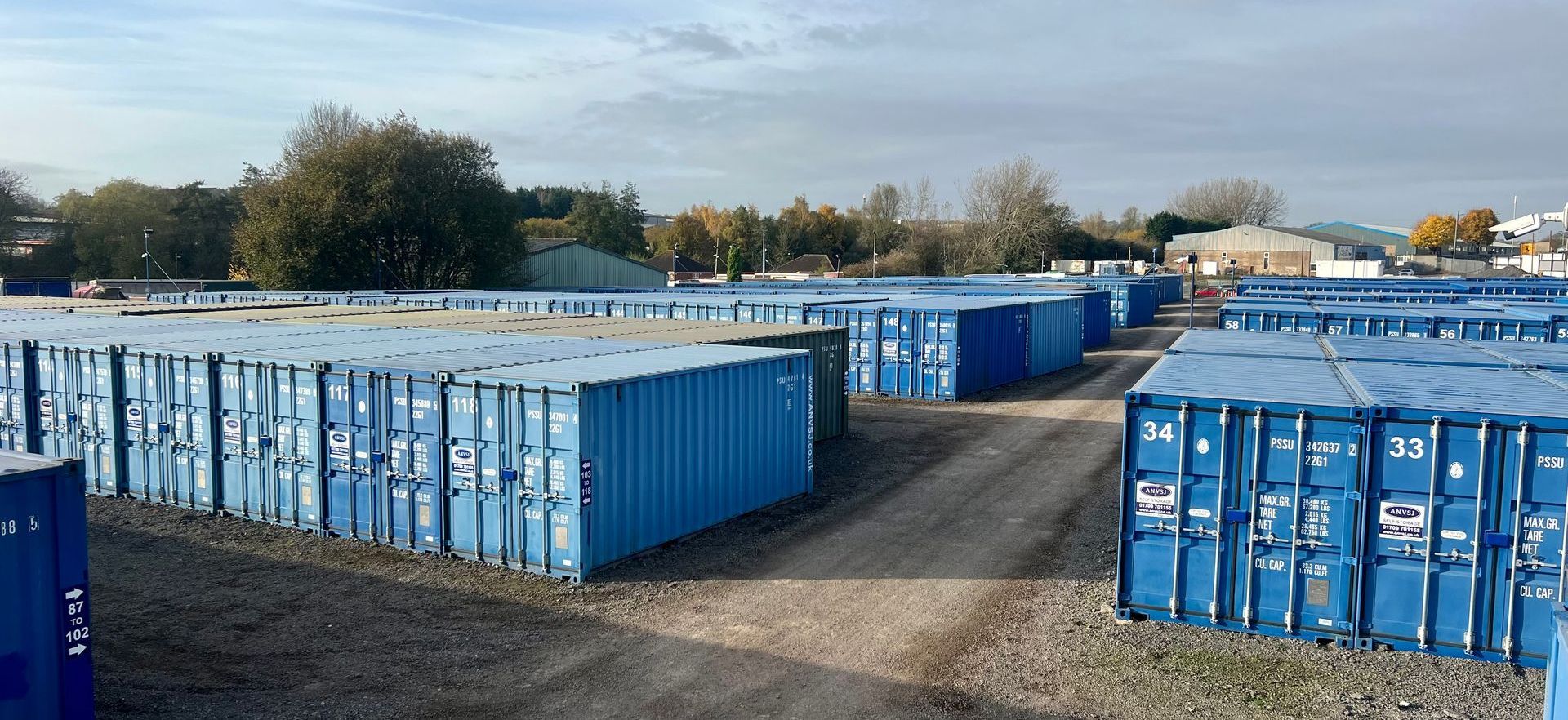 Blue storage containers with a path to walk through