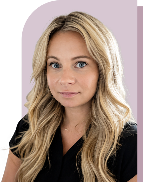 Portrait of a woman with long blonde hair in a black top against a light purple background