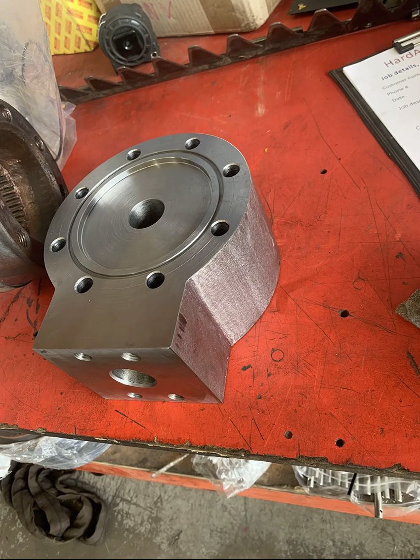 A Piece of Metal on Top of a Red Table — Hardarc Engineering in Coolum Beach, QLD