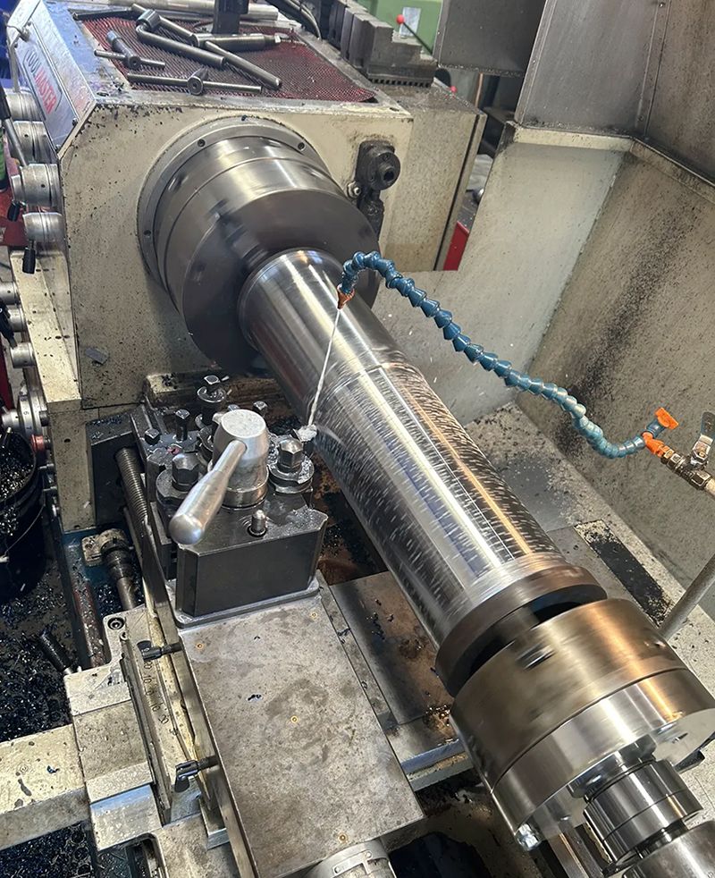 A Machine is Cutting a Piece of Metal on a Lathe — Hardarc Engineering in Coolum Beach, QLD