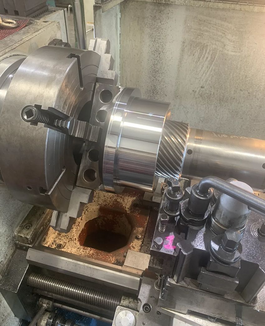 A Lathe is Being Used to Cut a Piece of Metal — Hardarc Engineering in Coolum Beach, QLD