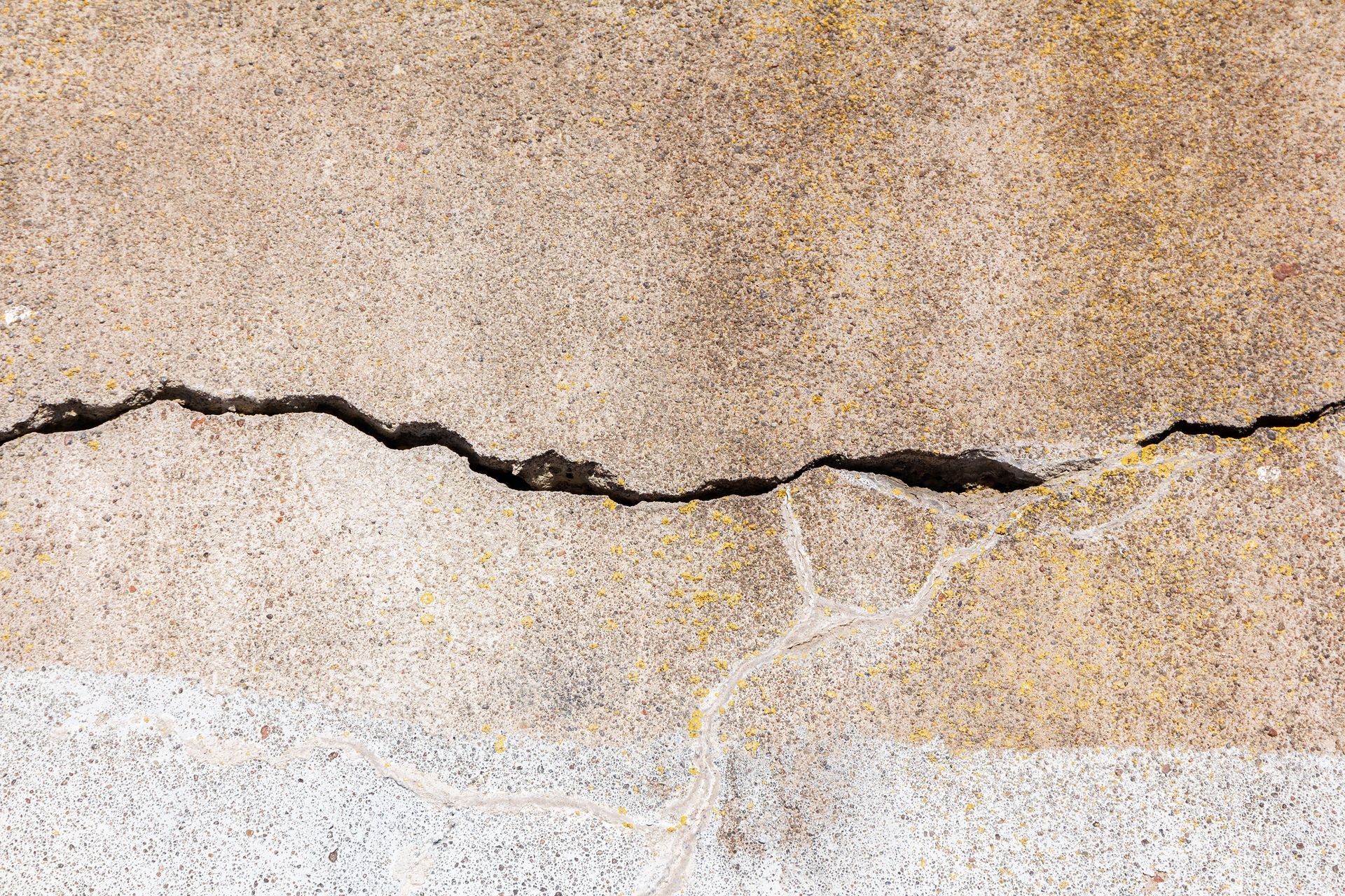 Horizontal crack in concrete wall, representing the need of basement wall crack repair services.