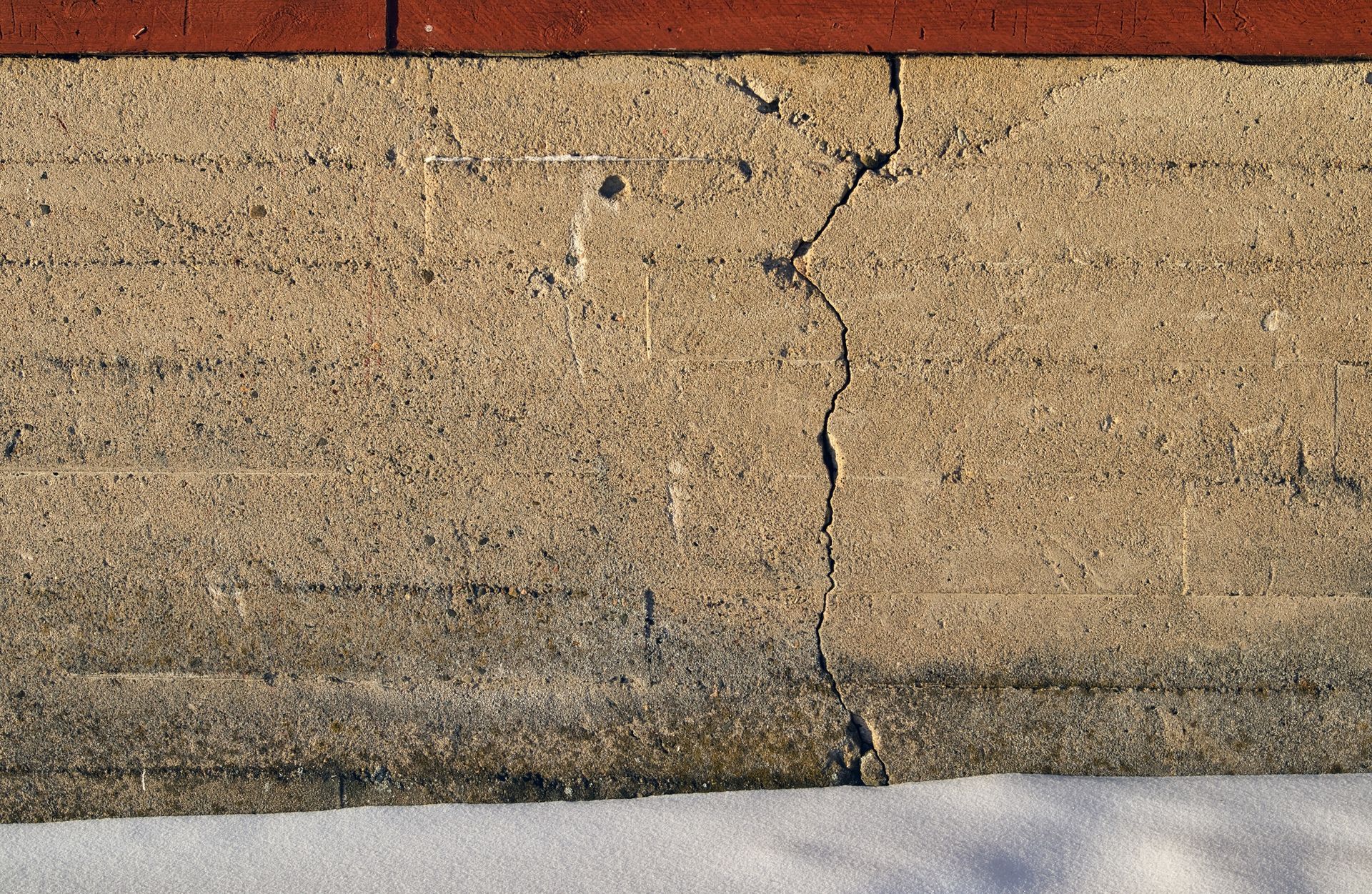 Crack in the foundation of a house.
