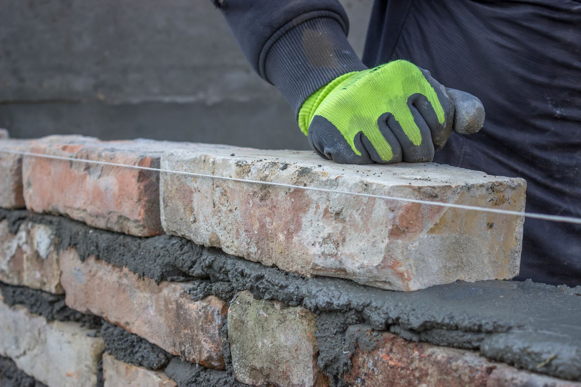 Close-up of worker offering Basement Wall Stabilization in St. Louis, MO.