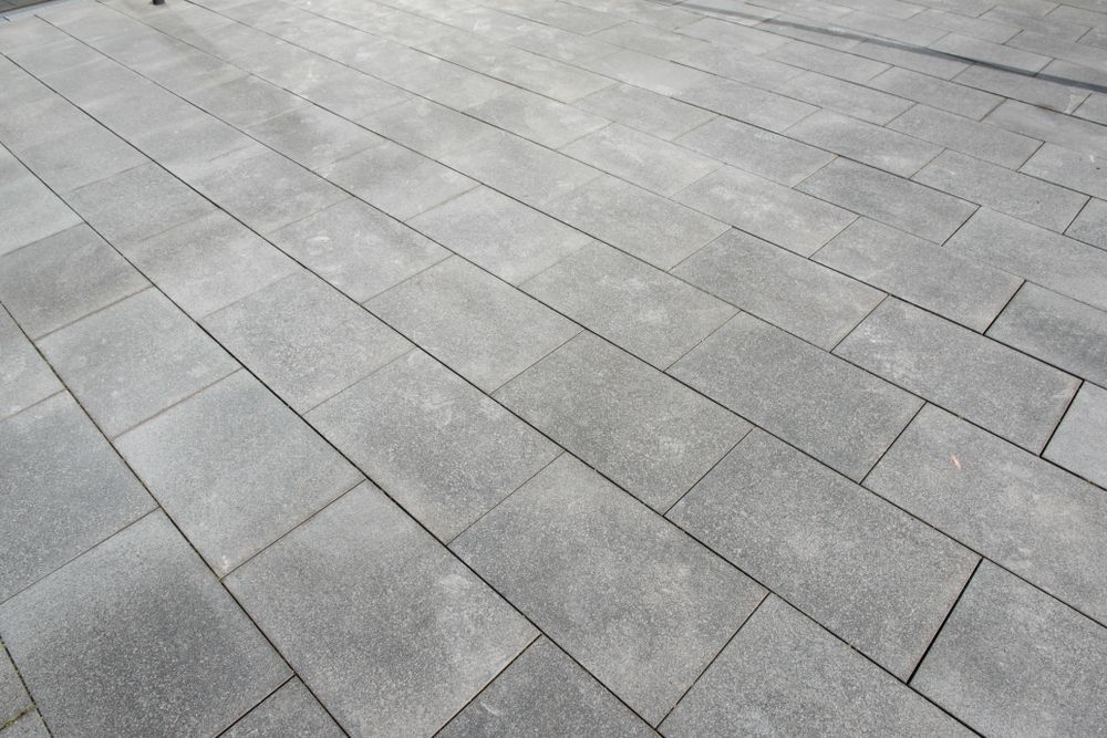 A Gray Tiled Floor With A Diagonal Pattern — Mid Coast Tiles Urunga In Urunga, NSW