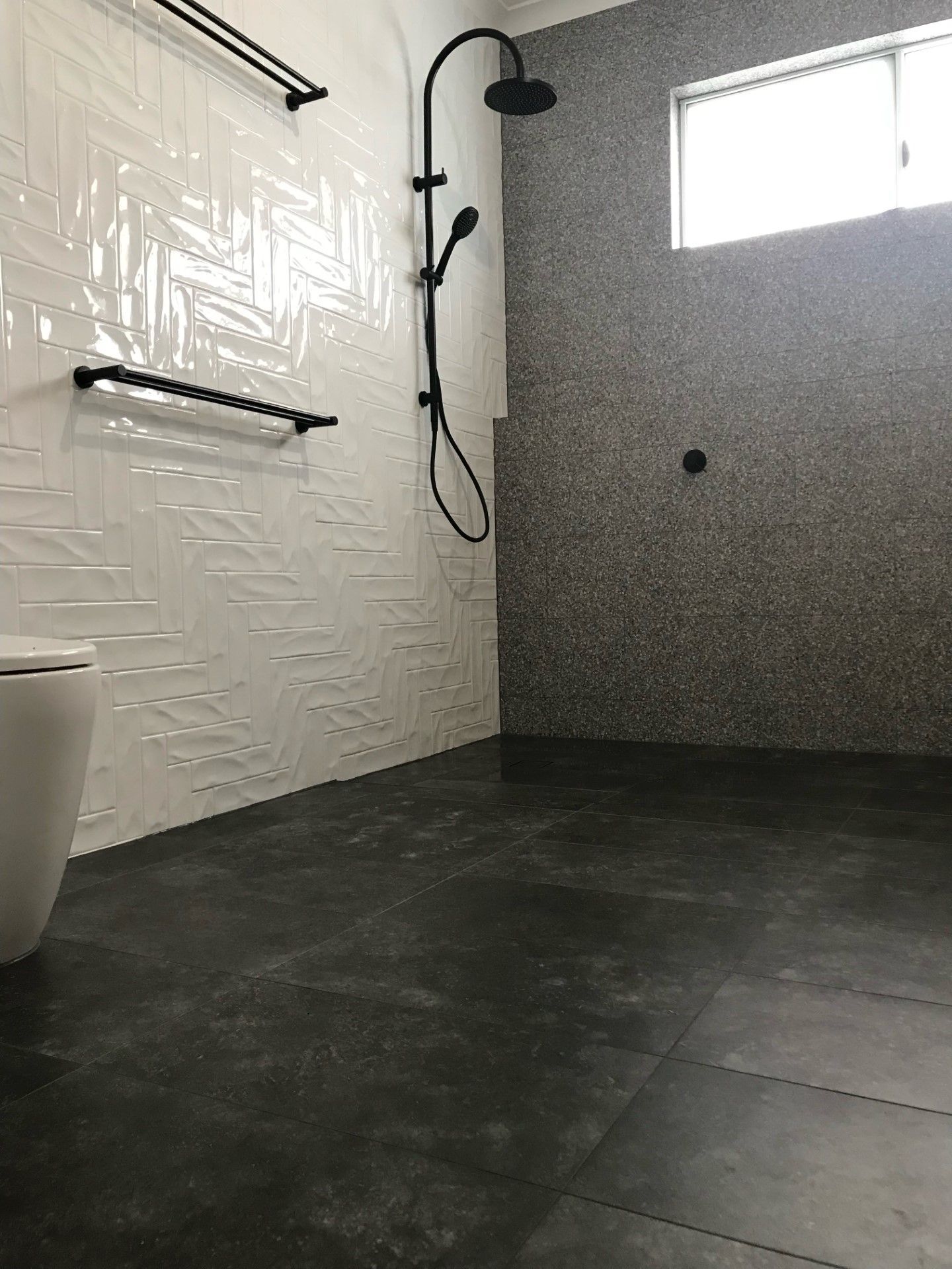 A Bathroom With A Shower , Toilet And Window — Mid Coast Tiles Urunga In Urunga, NSW