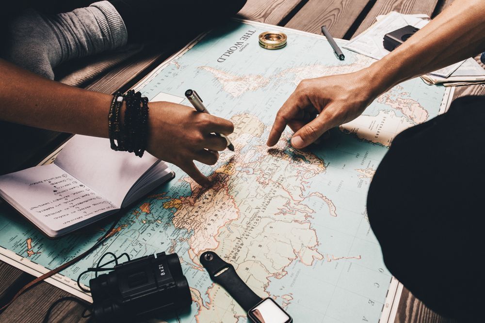 People Looking on a Map