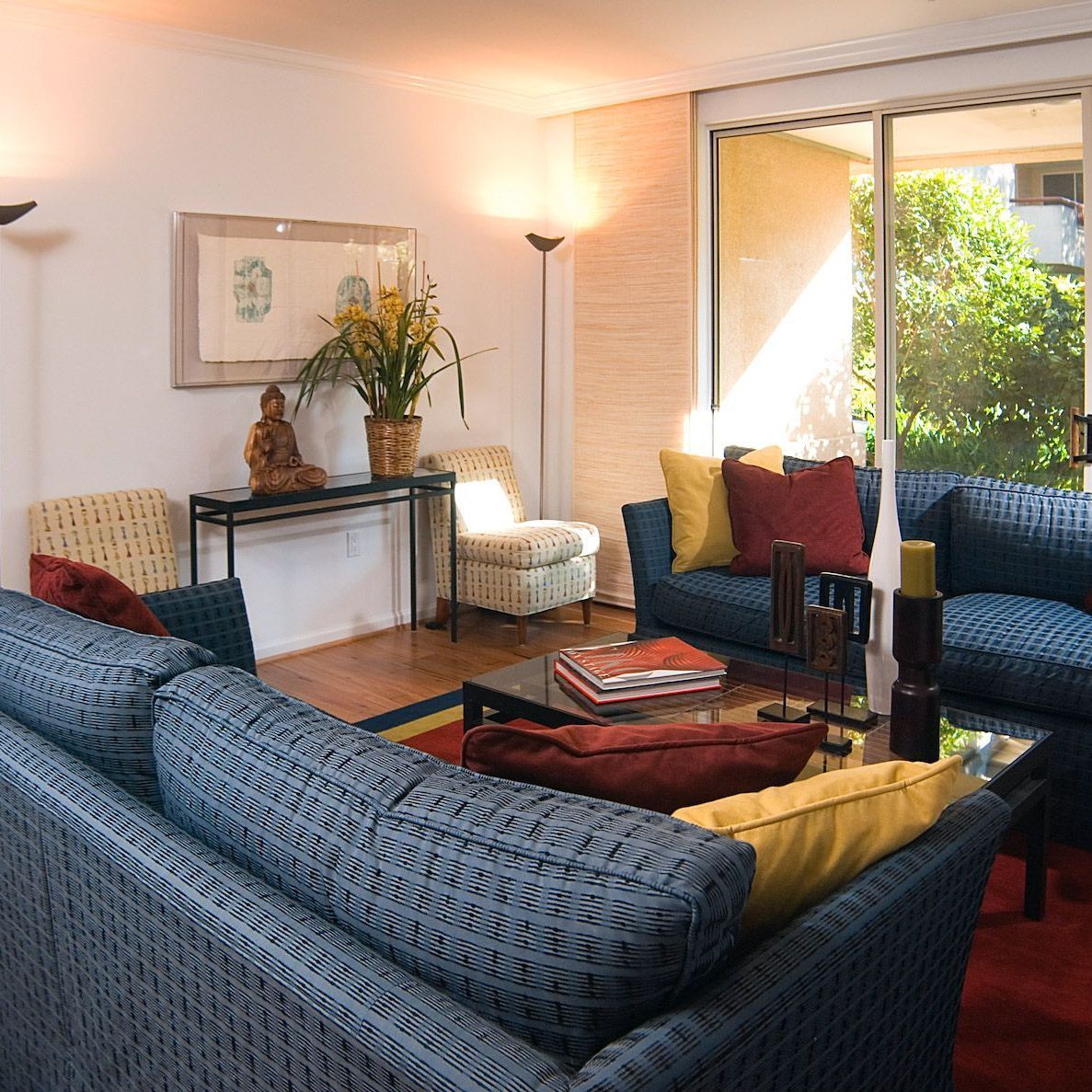 A living room filled with furniture and a sliding glass door