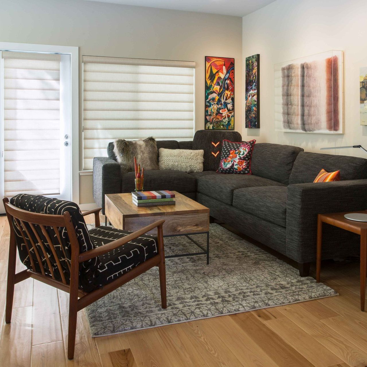 A living room with a couch a chair and a coffee table