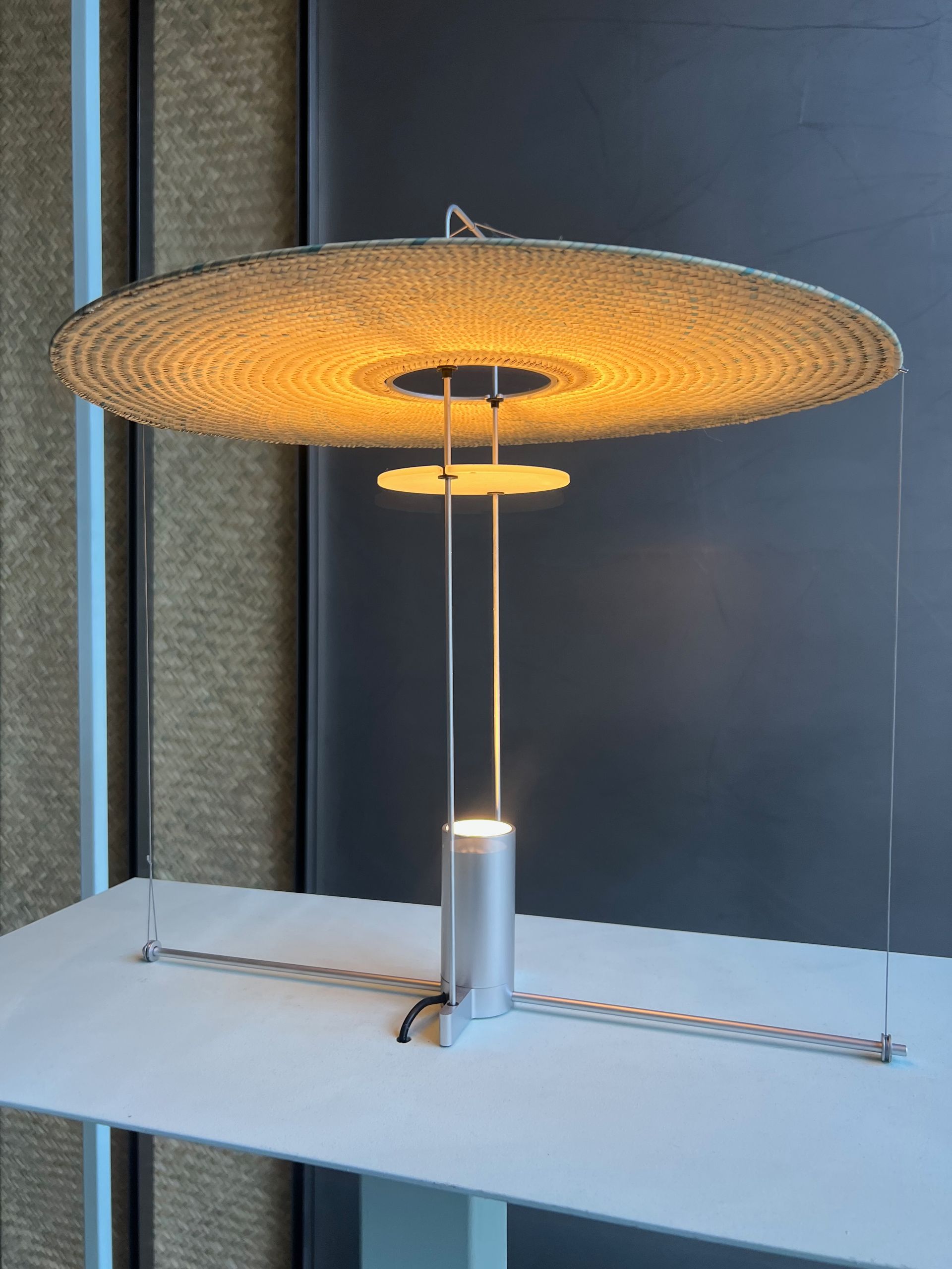 A lamp is sitting on top of a white table.