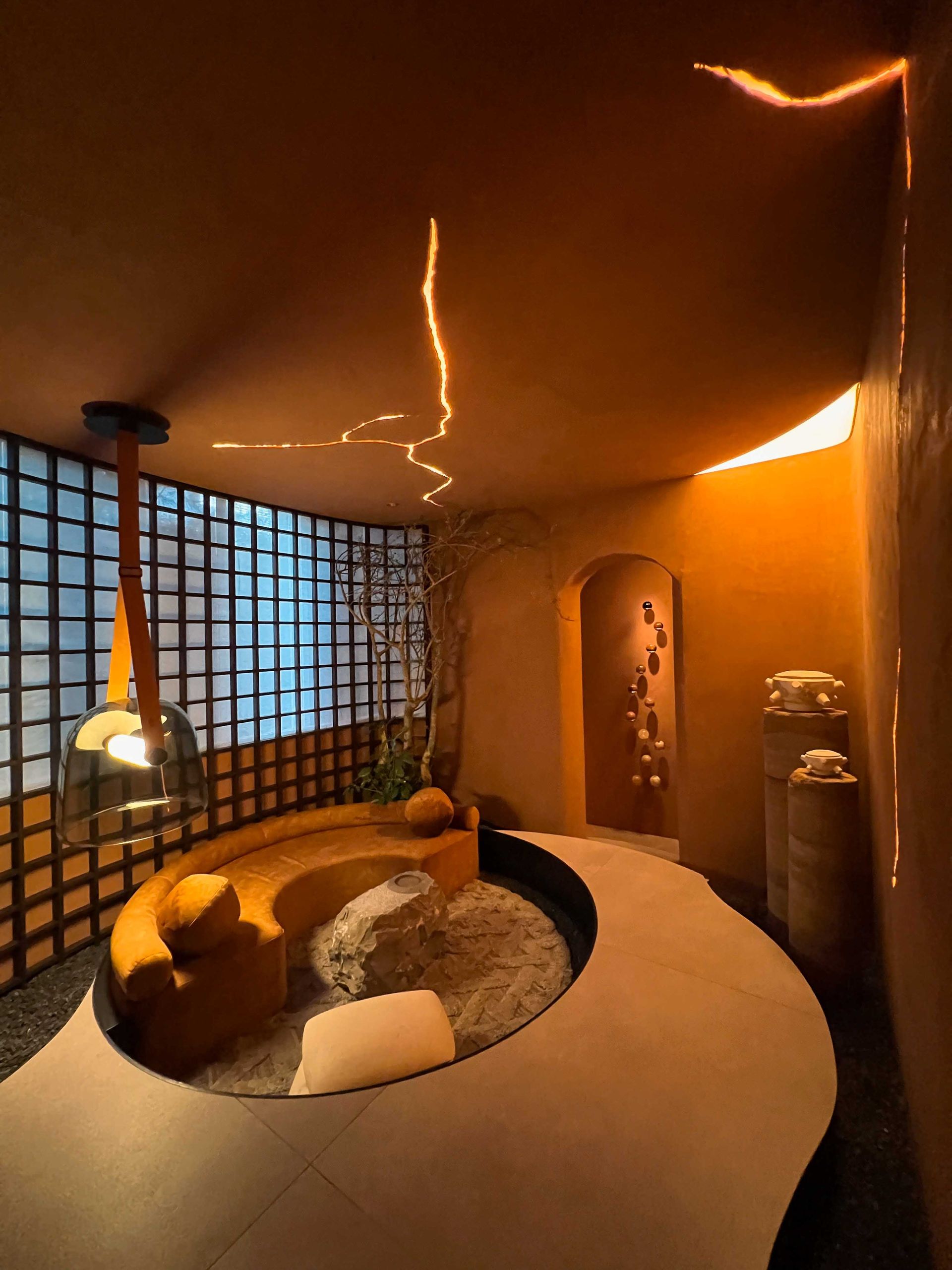 A room with a round table and a couch in it