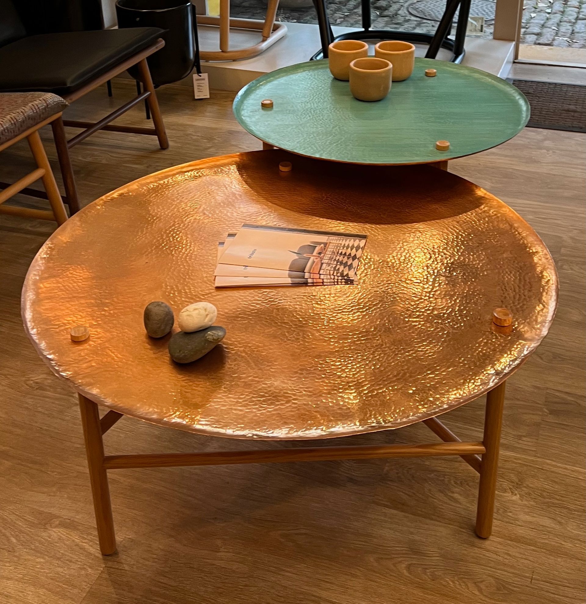 A copper coffee table with a magazine on it