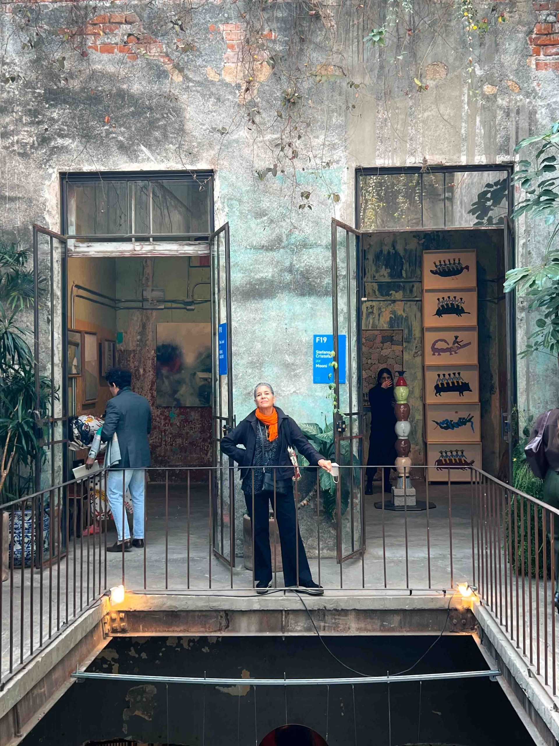 A woman is standing in a museum