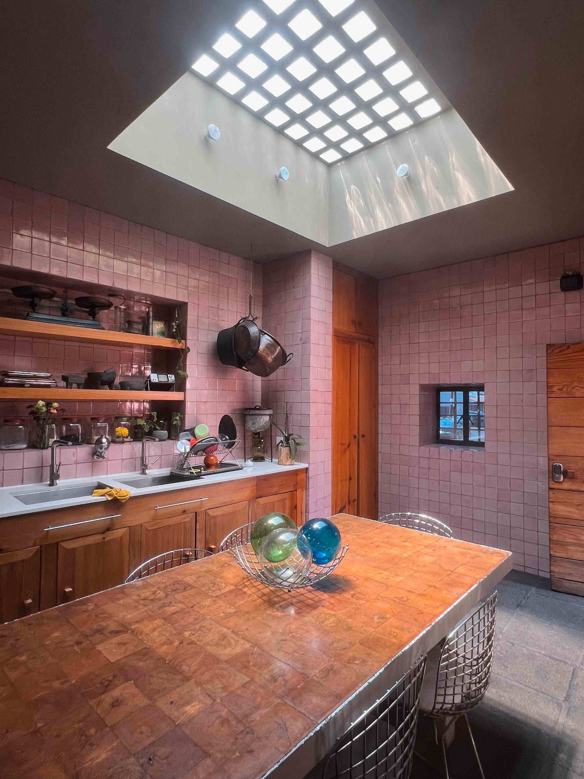 A kitchen with a skylight above the table in Luis Barragán's house