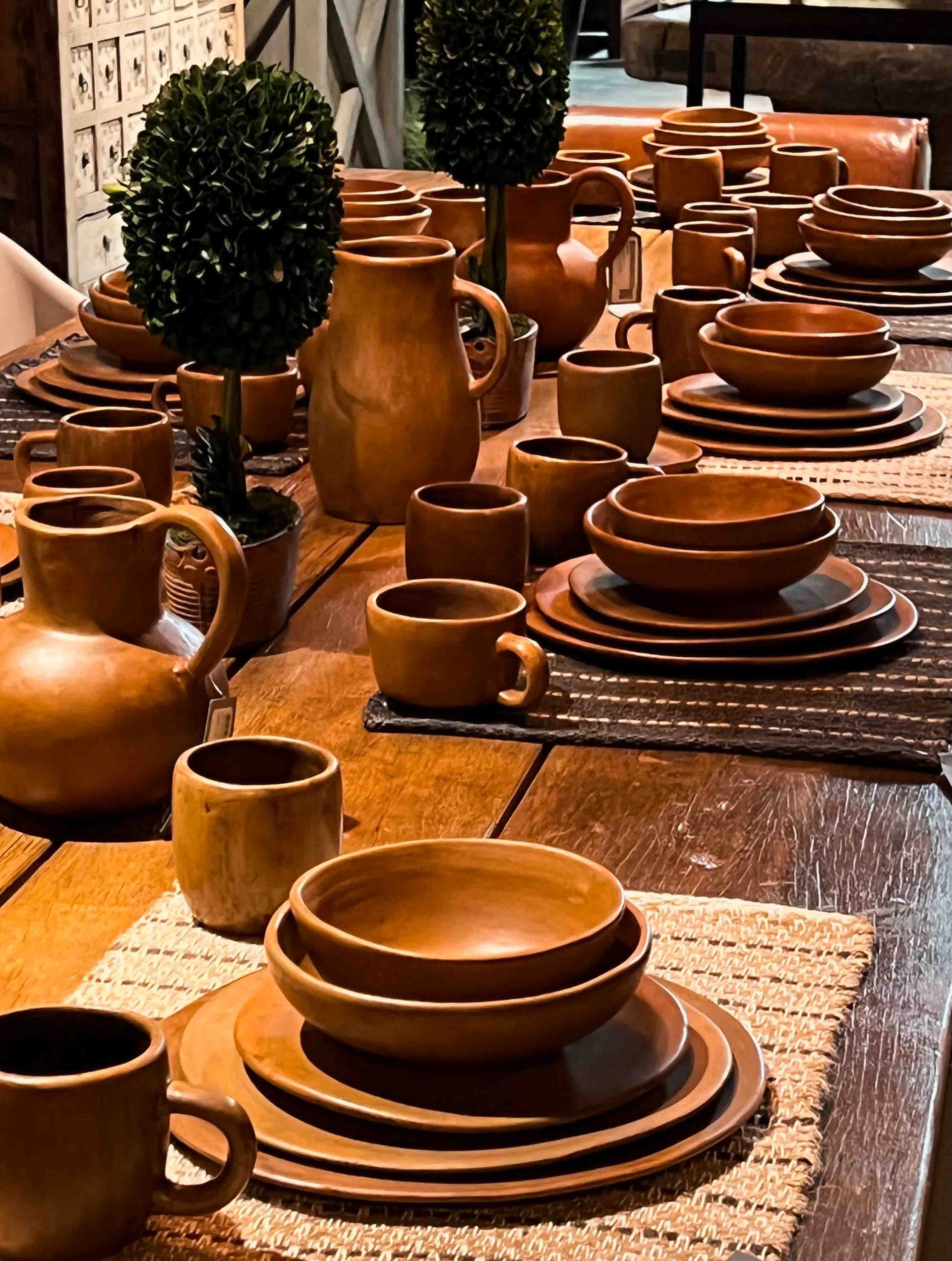 A table with a lot of bowls plates and cups on it