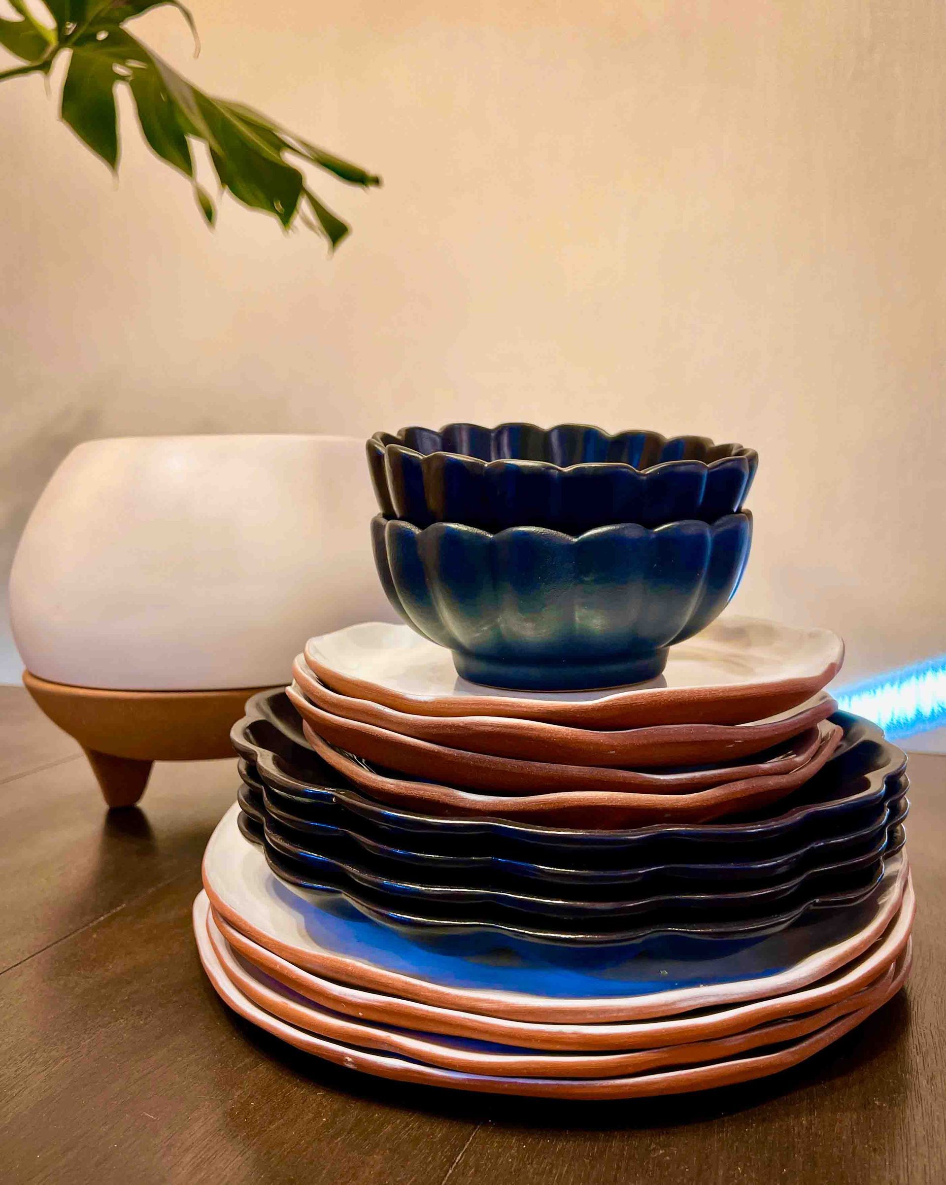 A stack of plates and bowls on a table