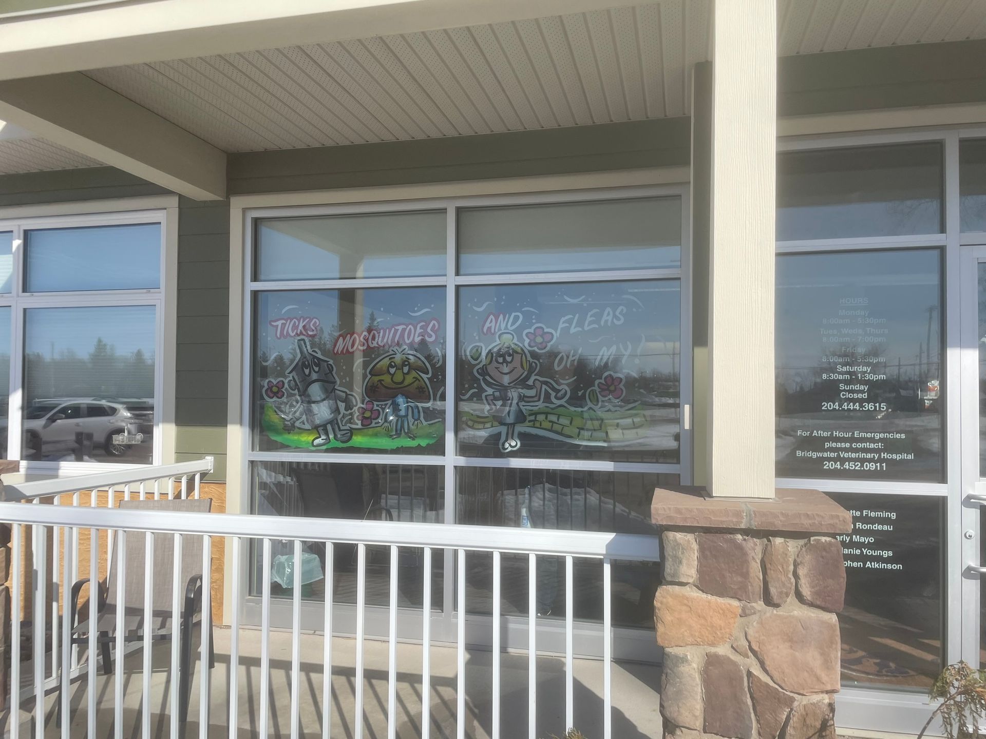 A building with a fence and a sign on the window that says 