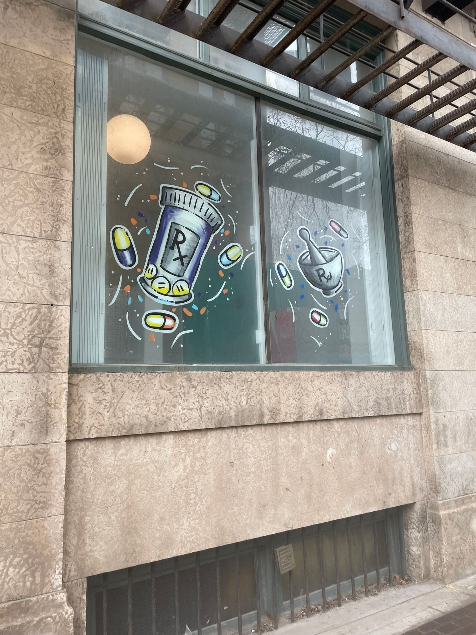 A window with a drawing of a bottle on it.