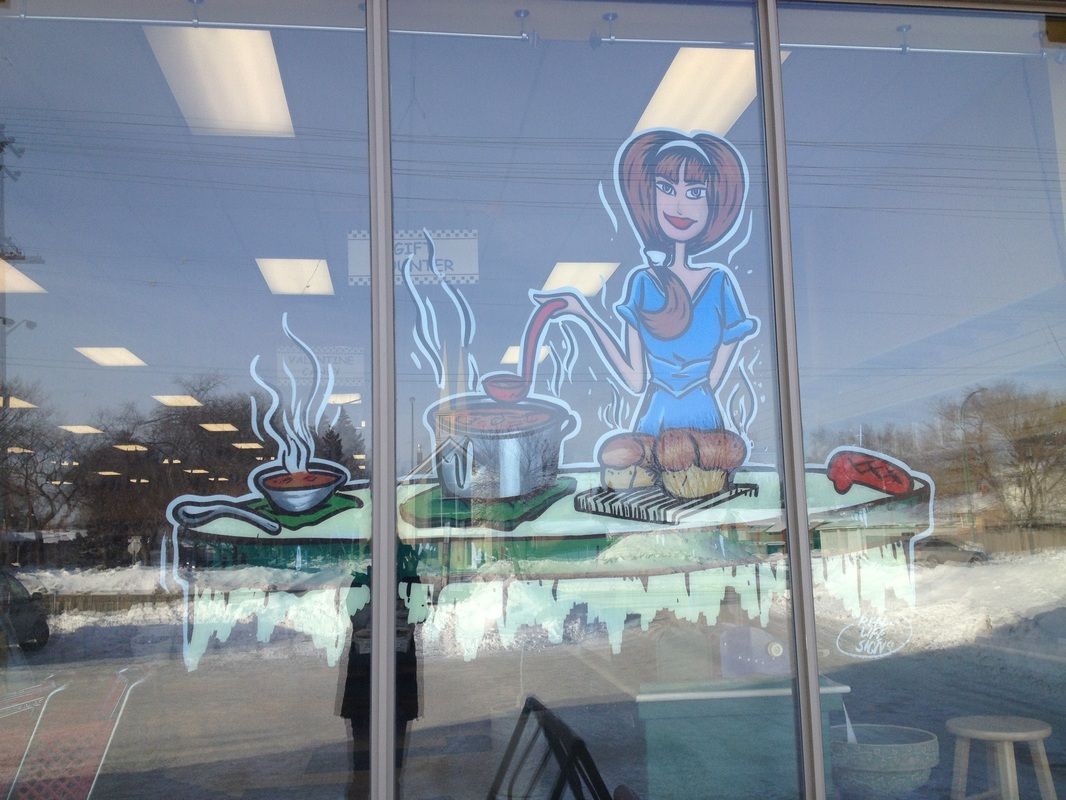 A window with a cartoon of a woman cooking on it