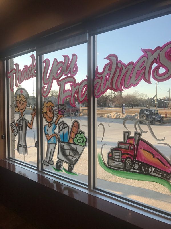 A window with drawings on it that says thank you for diners