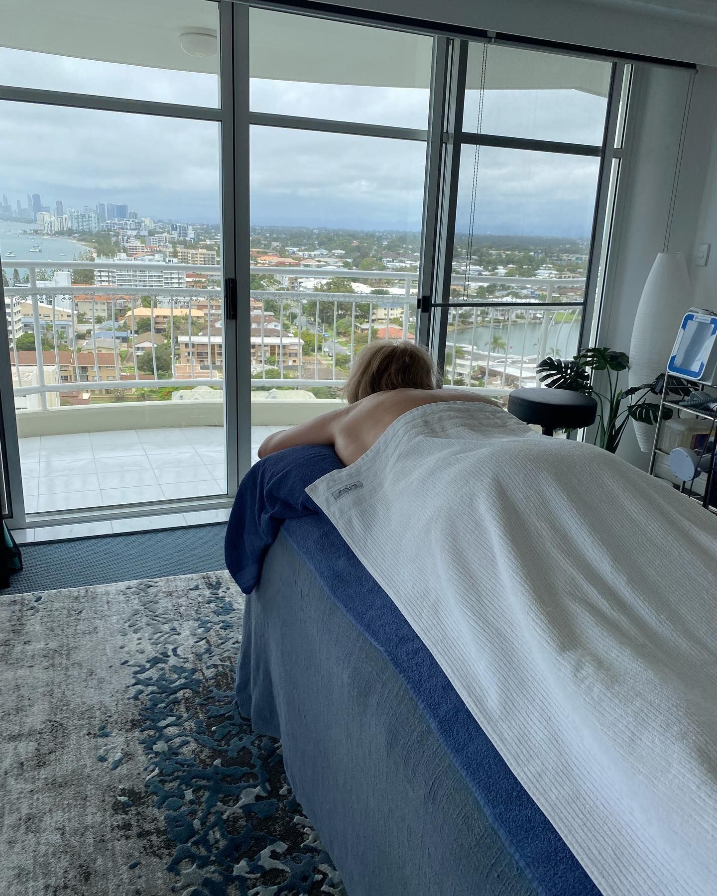 Person Lying Face Down on A Massage Table — Soul Good Beauty in Miami, QLD
