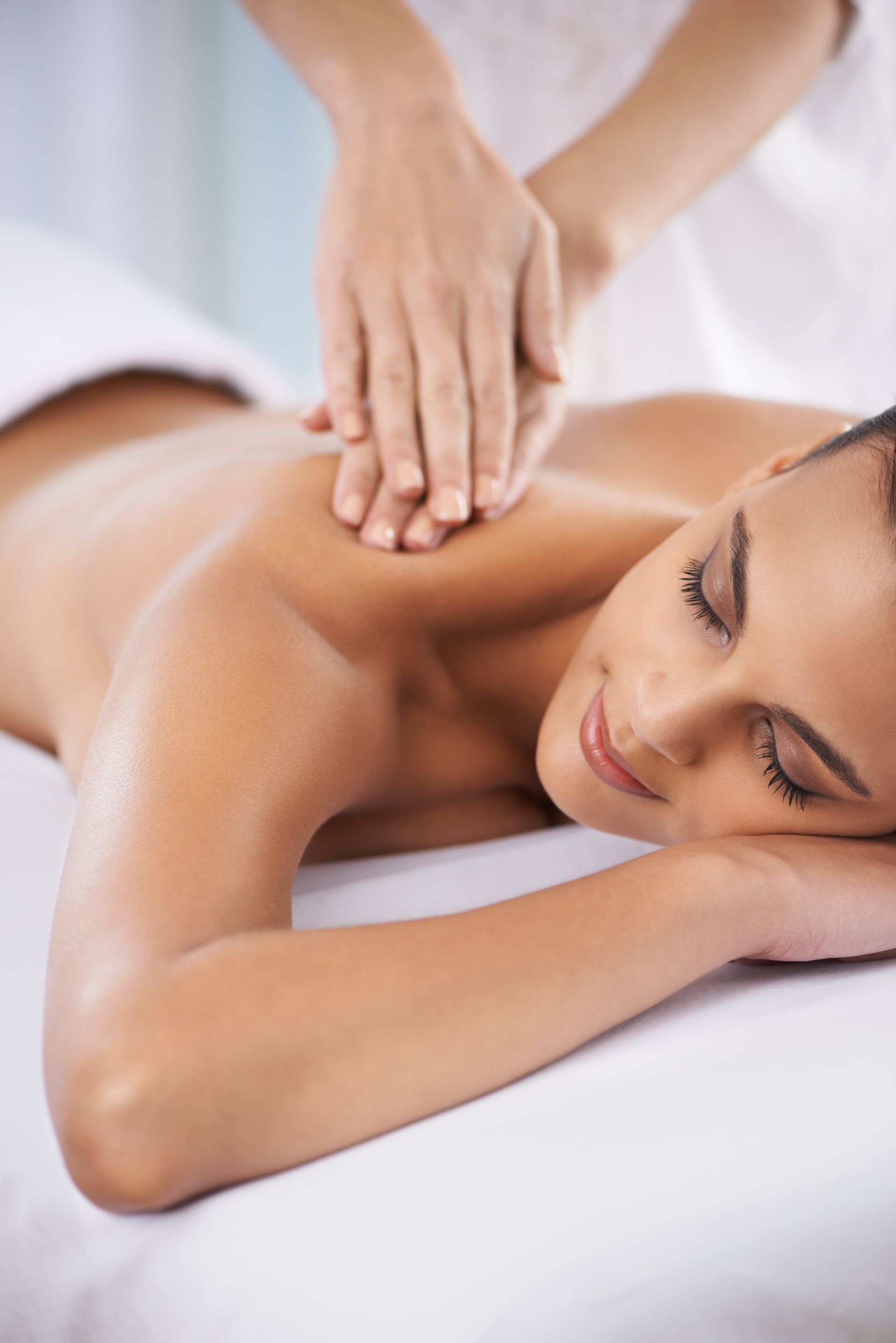 A person relaxing with eyes closed while receiving a shoulder massage at a spa — Soul Good Beauty in Miami, QLD