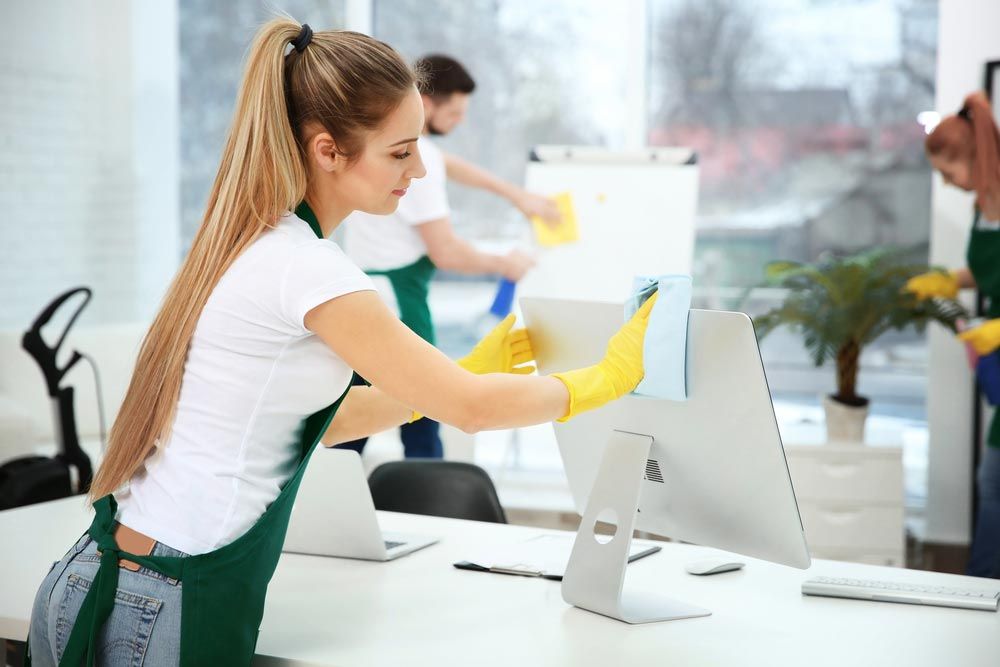 Group Of Commercial Cleaners In An Office