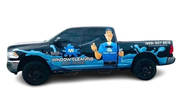 A truck that says window cleaning and more on the side