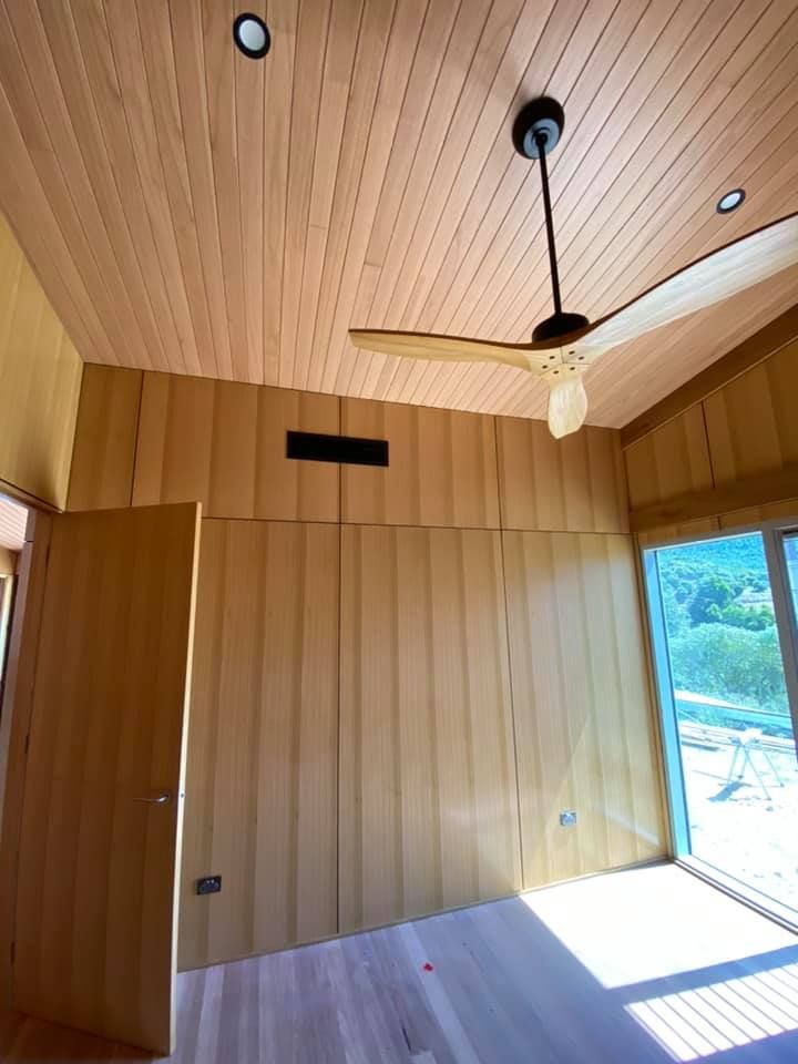 A Room With A Wooden Ceiling And A Ceiling Fan — Aircon Mid North Coast in Port Macquarie, NSW