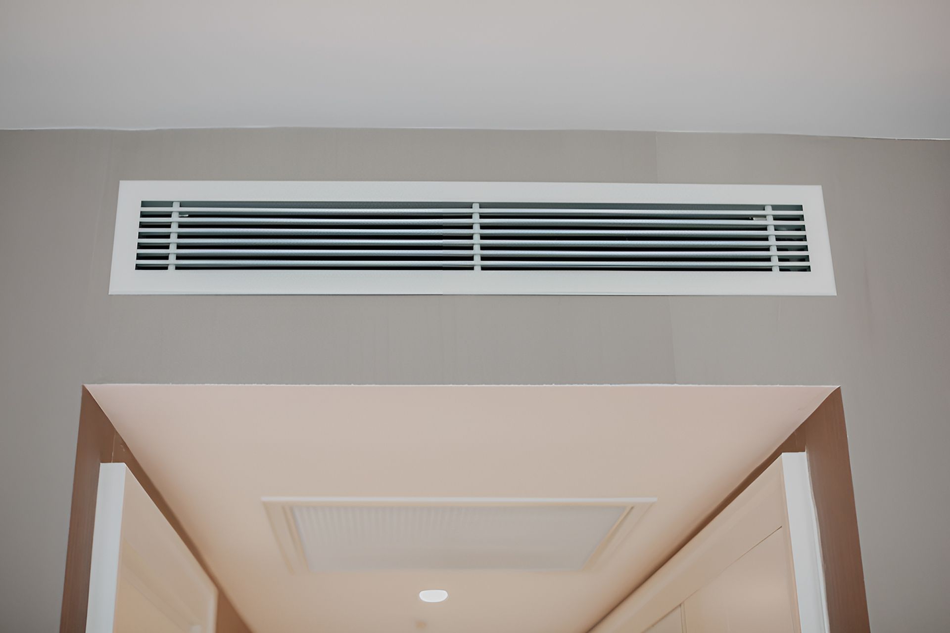 Man Working To Install An Air Conditioning Unit