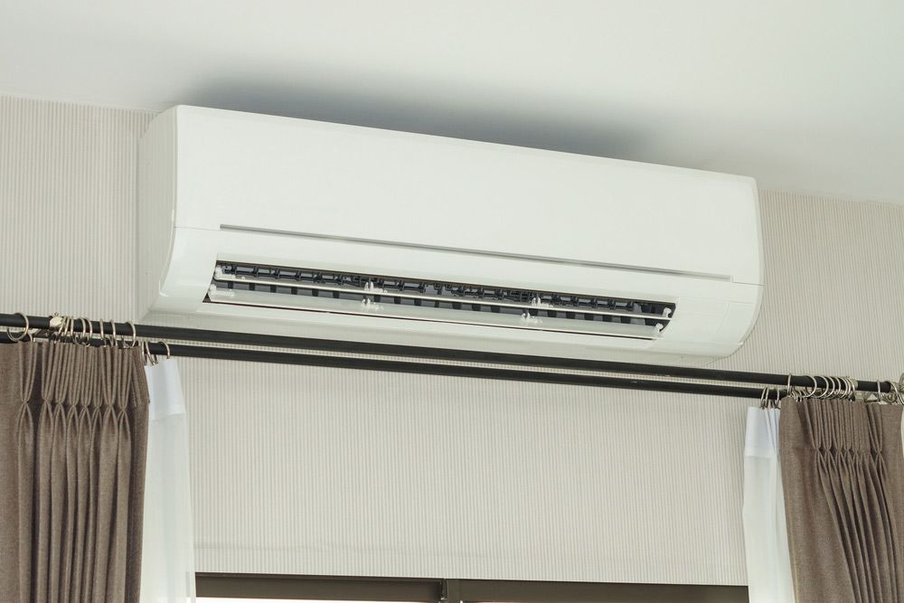An Air Conditioner is Mounted to the Ceiling — Air Conditioning Electricians in Forster, NSW