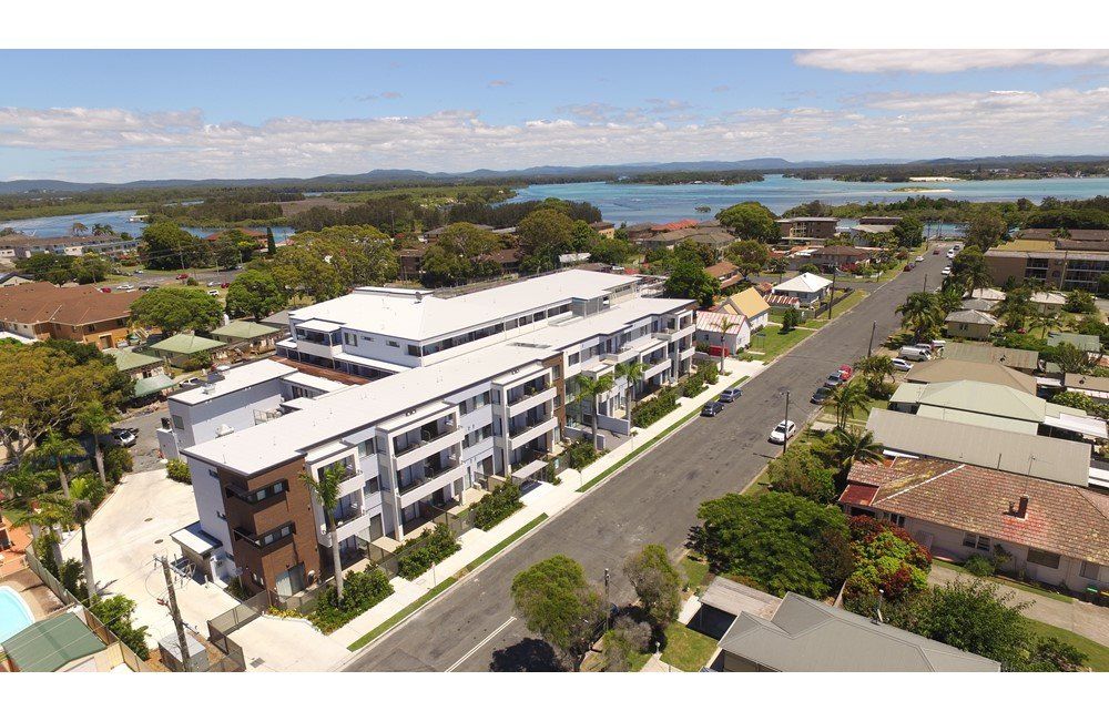 An Aerial View Of A Large Apartment Building In A Residential Area — Aircon Mid North Coast in Forster, NSW
