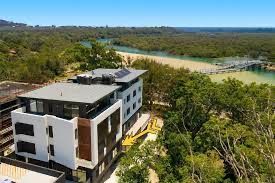 An Aerial View Of A Large Building Surrounded By Trees And A Beach — Aircon Mid North Coast in Forster, NSW