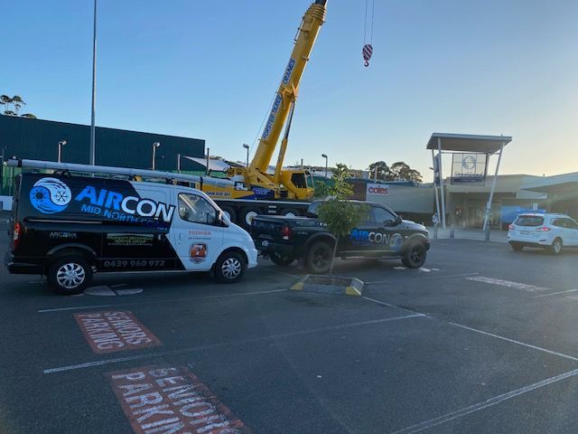 A Van With The Word Aircon On It Is Parked In A Parking Lot — Aircon Mid North Coast in Forster, NSW