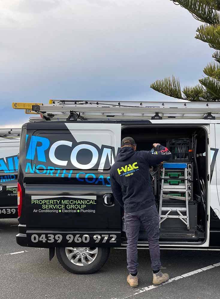 Man Putting The Tools In The Van — Aircon Mid North Coast in Forster, NSW