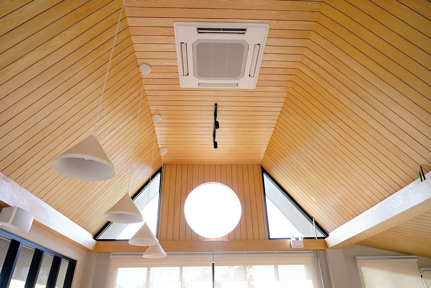 Wood-Paneled Vaulted Ceiling With Recessed Air Conditioning