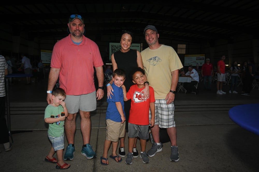 A group of people are posing for a picture together.