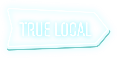 A blue sign that says `` true local '' on a white background.