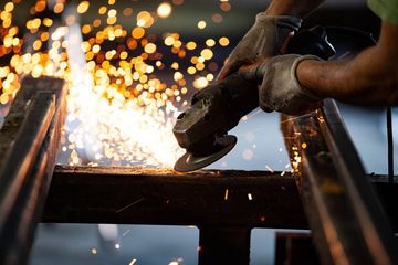 Power Tool Working in Metal Workshop
