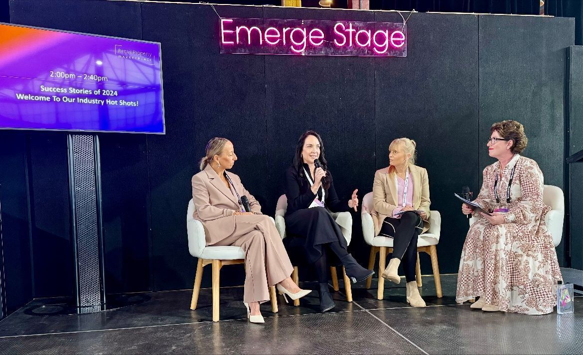 Four people participate in a panel discussion on the 