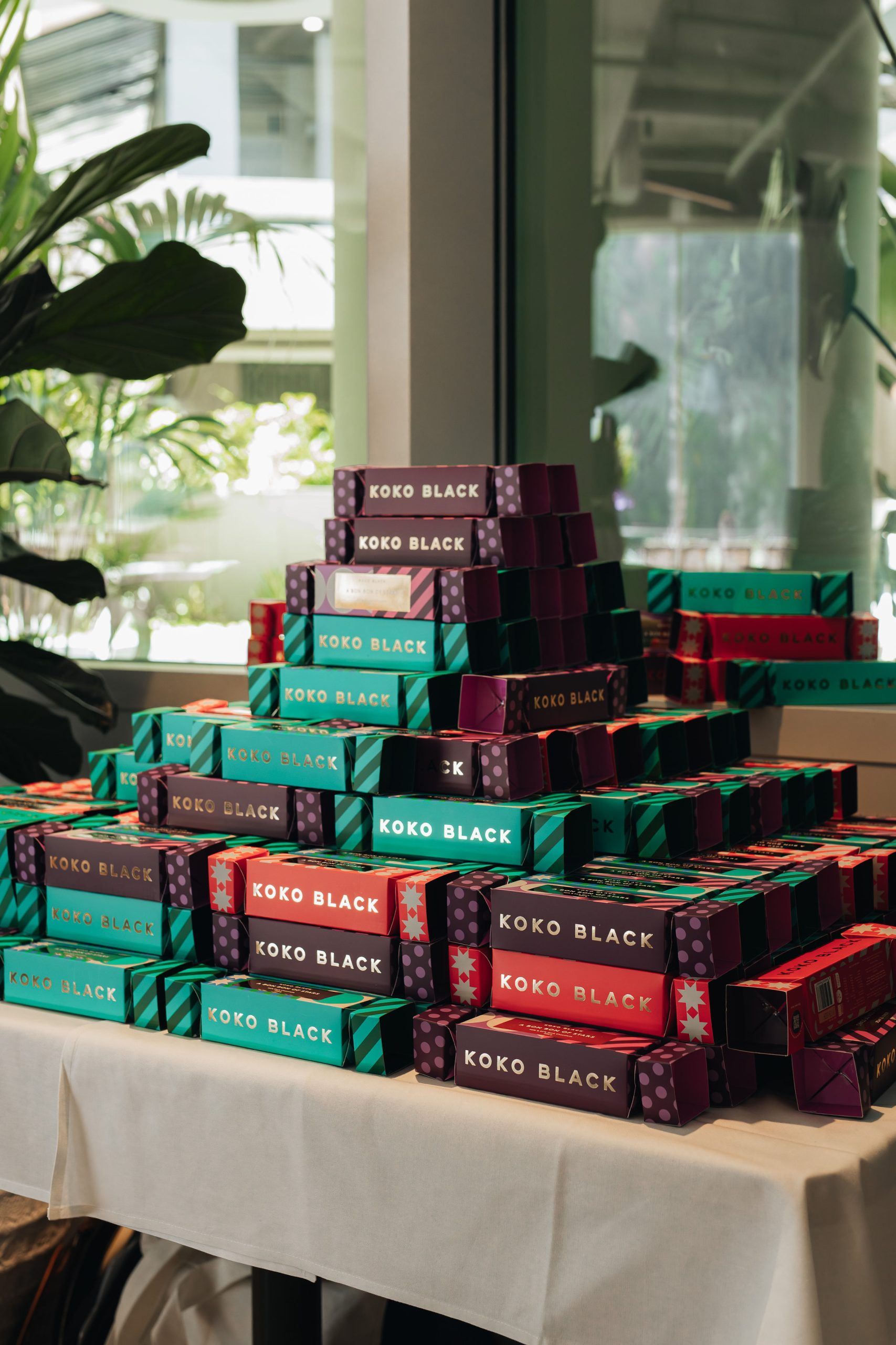 A stack of red and teal product boxes labeled