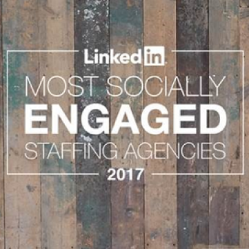 An award badge reading: LinkedIn Most Socially Engaged Staffing Agencies 2017, centered on a rustic, weathered wood background.