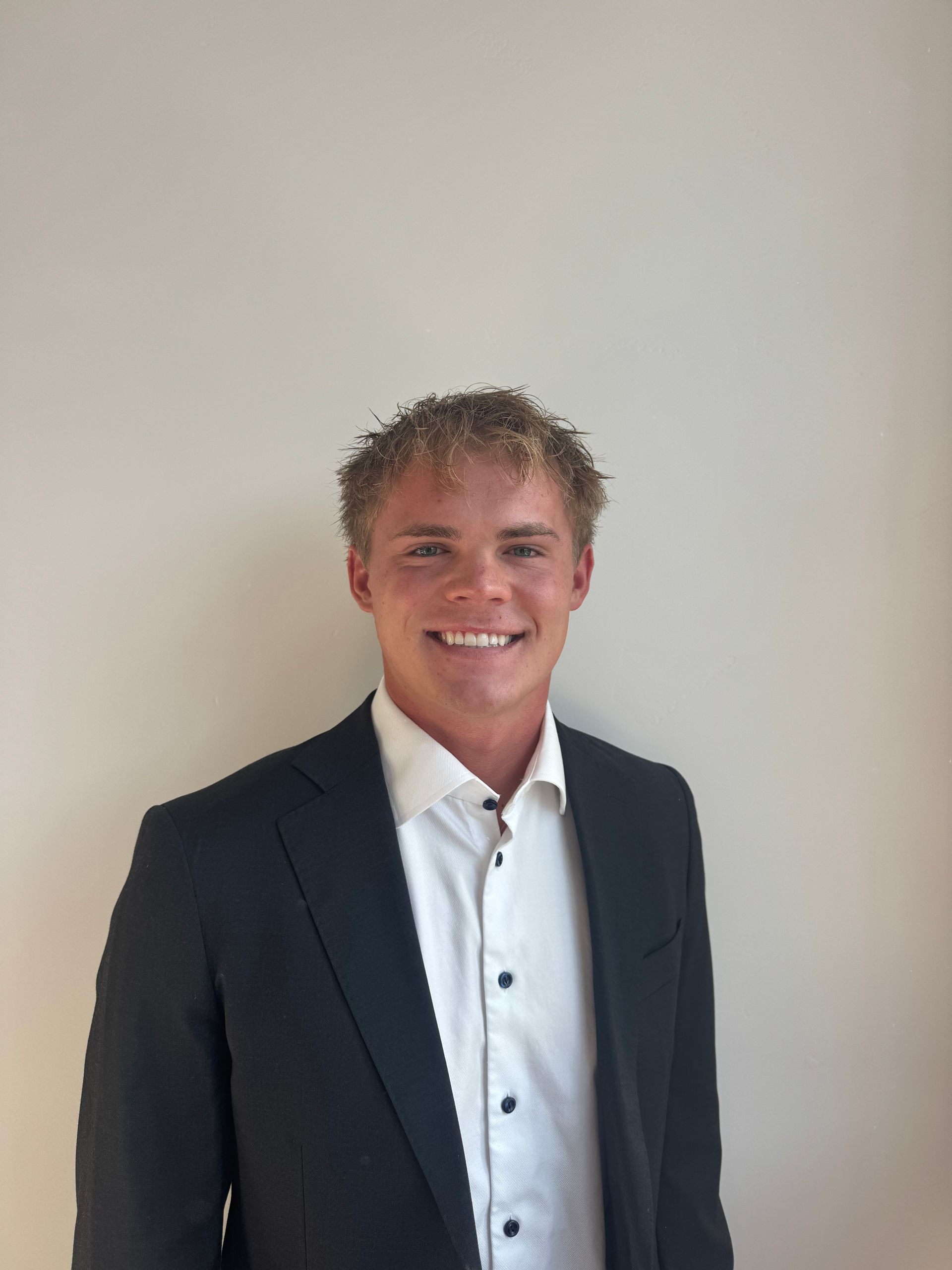 man in blazer with white shirt