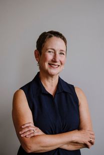 Lisa M. Coutu — three-quarter portrait with warm smile