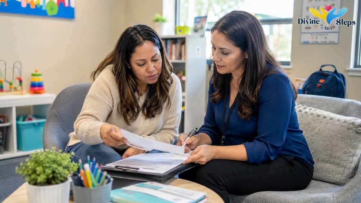 Parent and clinician reviewing a document together in a therapy office
