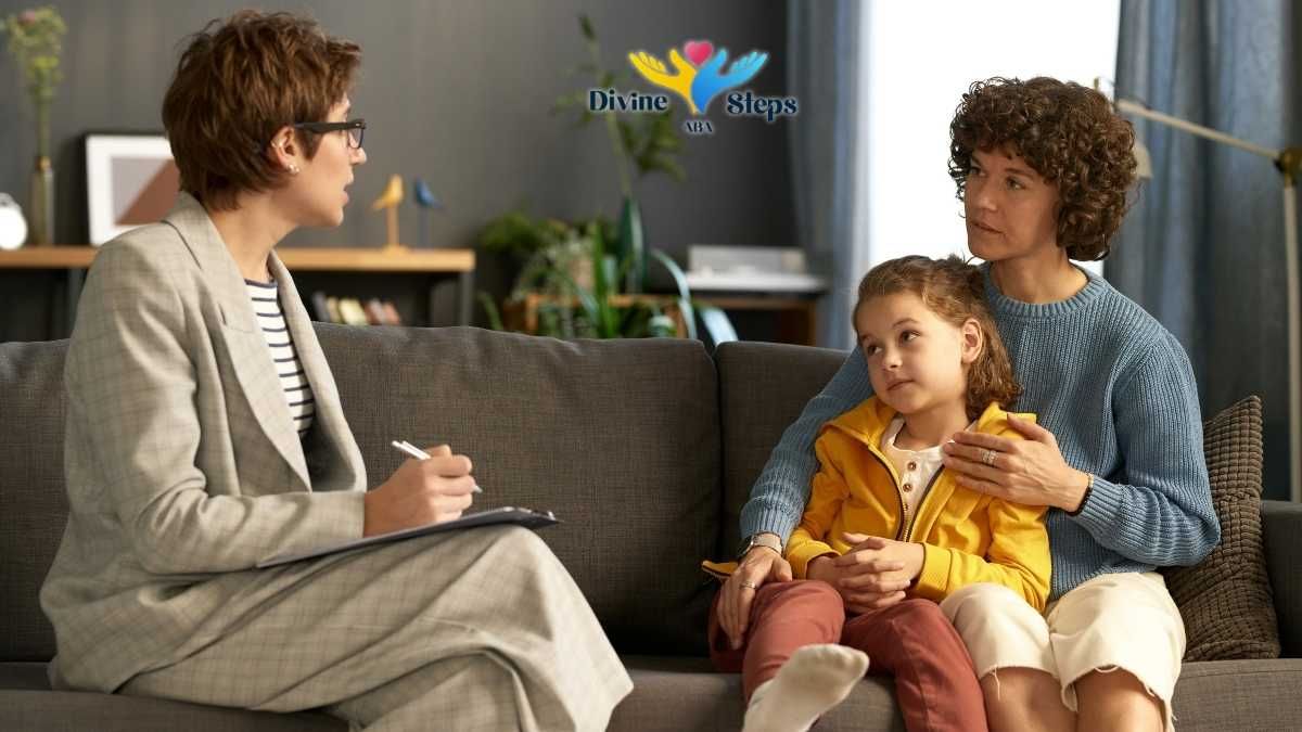 clinician-with-clipboard-speaking-to-mother-and-child