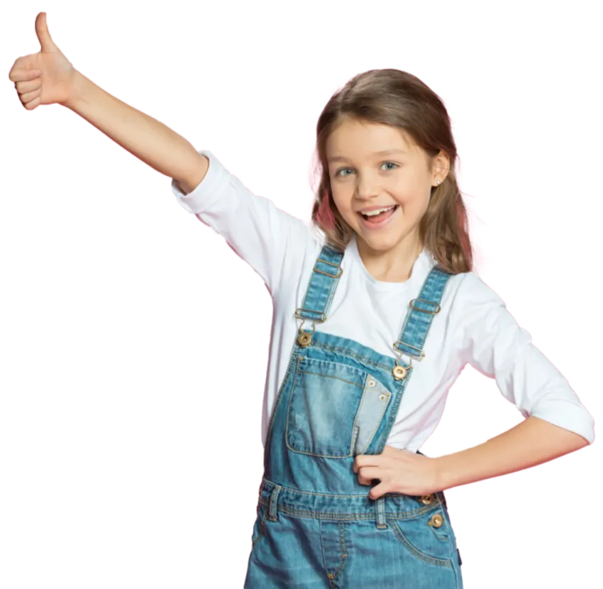 Girl in denim overalls and white shirt gives a thumbs-up, smiling.